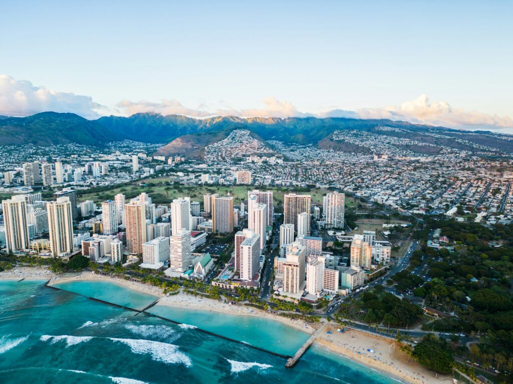 Honolulu with green mountains and valleys behind