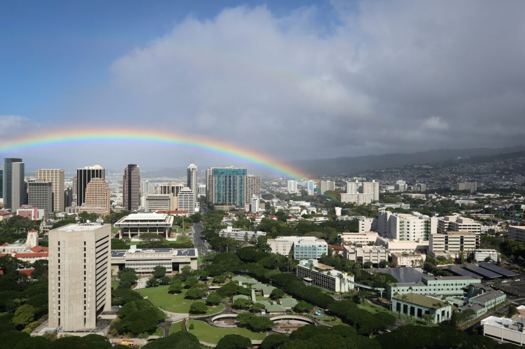 Rainbow over Honolulu buildings