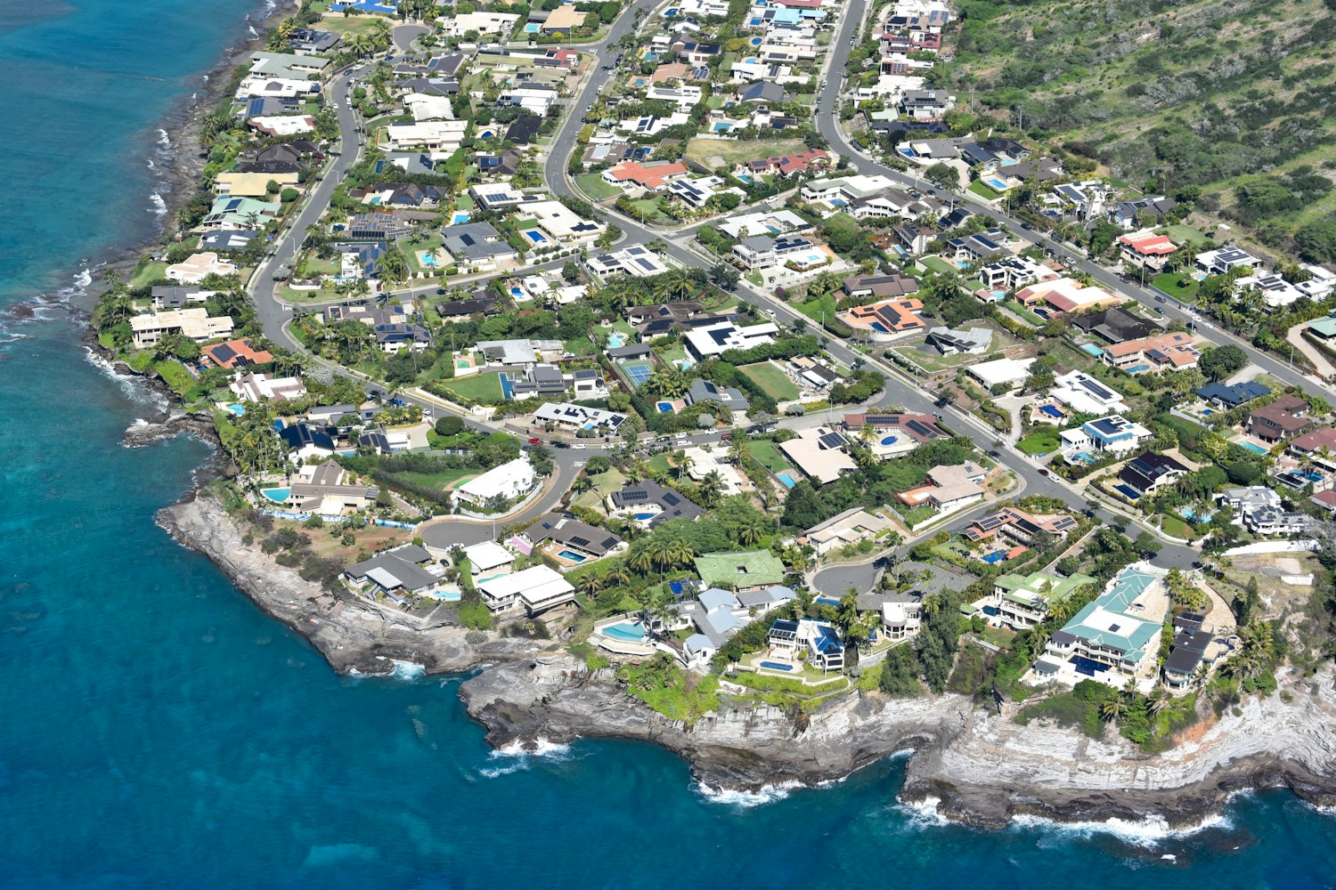 Aerial view of an Oahu residential neighborhood by the ocean